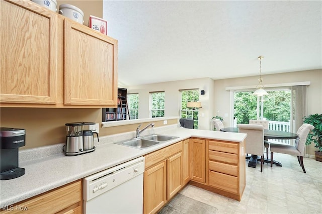 1917 Northgate Cir, Akron, OH 44320 - kitchen featuring white dishwasher, light brown cabinets, a sink, a peninsula, and light countertops