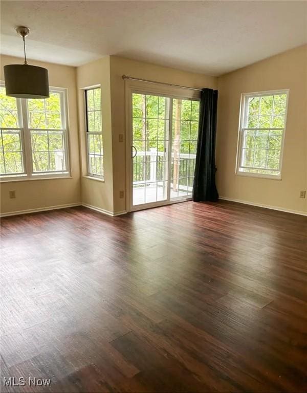 1808 Stoney Run Cir, Broadview Heights, OH 44147 - spare room with baseboards, dark wood-type flooring, and healthy amount of natural light