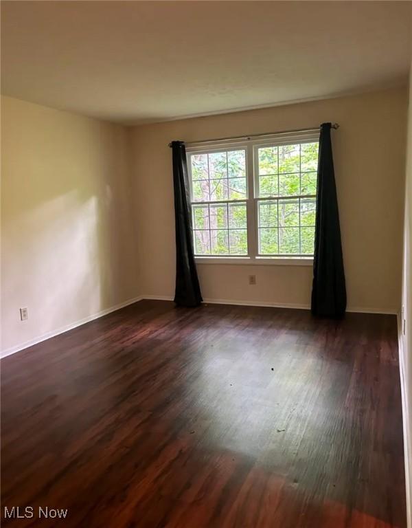 1808 Stoney Run Cir, Broadview Heights, OH 44147 - spare room featuring dark wood-type flooring and baseboards