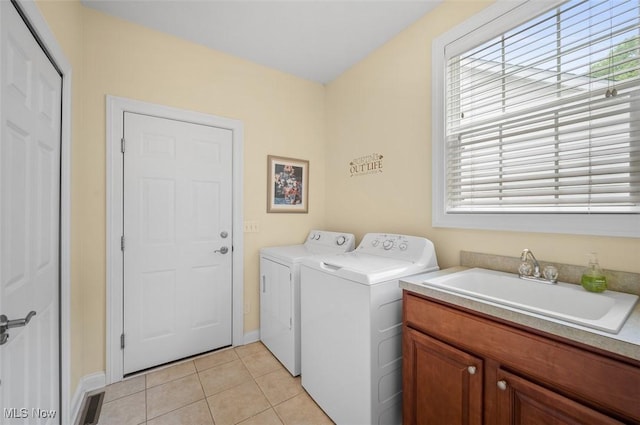 4819 Trails End Ct, Westlake, OH 44145 - laundry room with washing machine and clothes dryer, light tile patterned floors, baseboards, and cabinet space