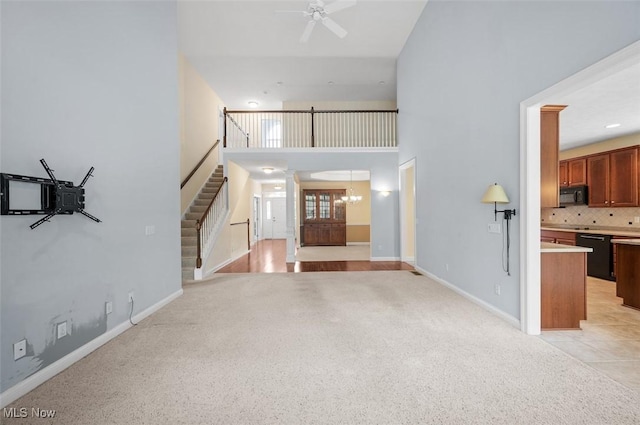4819 Trails End Ct, Westlake, OH 44145 - entrance foyer featuring a high ceiling, light colored carpet, stairway, a ceiling fan, and baseboards