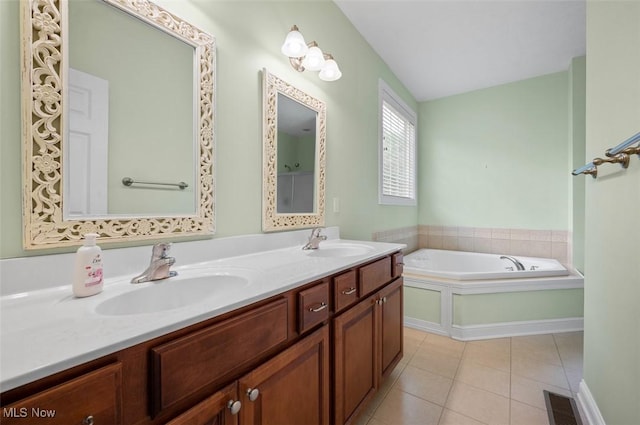 4819 Trails End Ct, Westlake, OH 44145 - bathroom featuring double vanity, tile patterned floors, a garden tub, and vaulted ceiling