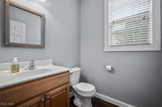 4819 Trails End Ct, Westlake, OH 44145 - half bathroom featuring toilet, vanity, and baseboards