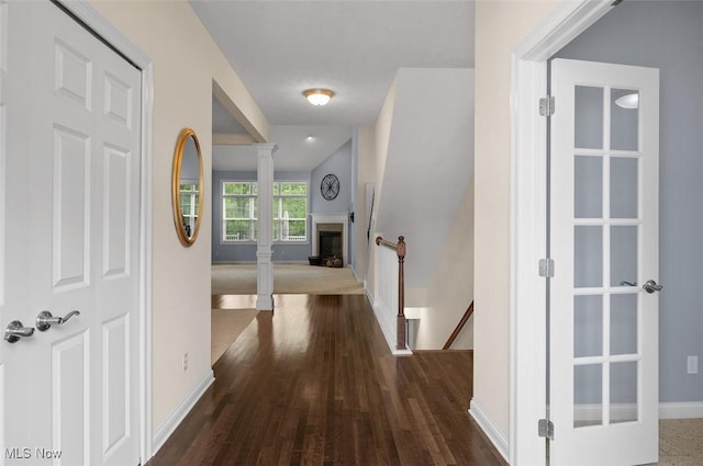 4819 Trails End Ct, Westlake, OH 44145 - corridor with an upstairs landing, dark wood-style flooring, and baseboards