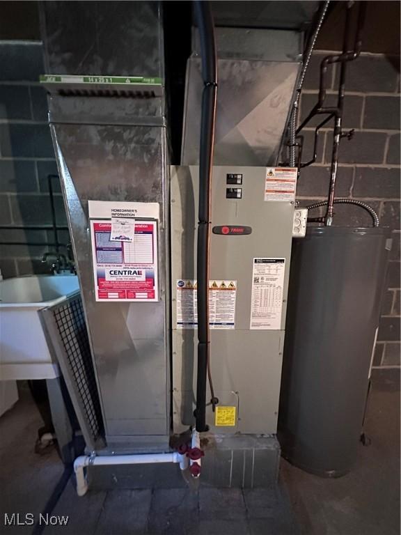 547 Towns Ln Unit 129, Richmond Heights, OH 44143 - utility room featuring water heater and heating unit
