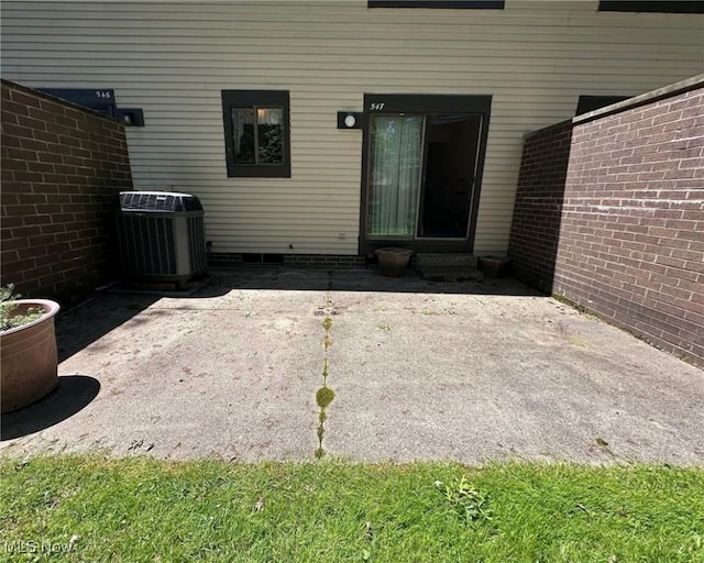 547 Towns Ln Unit 129, Richmond Heights, OH 44143 - property entrance with central air condition unit and a patio