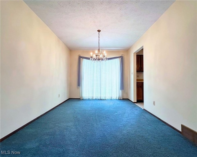 547 Towns Ln Unit 129, Richmond Heights, OH 44143 - unfurnished room featuring a chandelier, light carpet, baseboards, and a textured ceiling