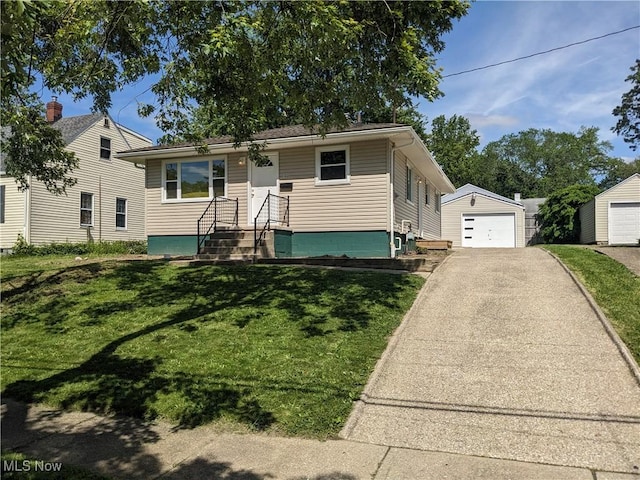 871 Chinook Ave, Akron, OH 44305 - bungalow-style home with a garage, driveway, a front lawn, and an outbuilding
