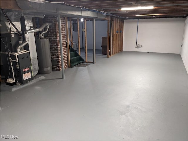 871 Chinook Ave, Akron, OH 44305 - unfinished below grade area featuring water heater, stairway, and heating unit