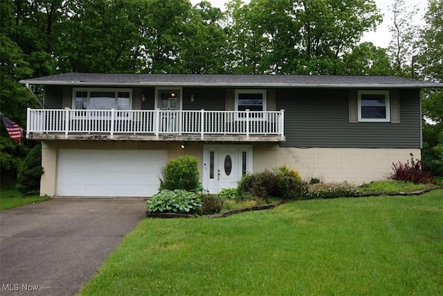 1259 Cherry Ln, Brunswick, OH 44212 - front facade featuring driveway, a front yard, and an attached garage