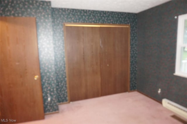 1259 Cherry Ln, Brunswick, OH 44212 - unfurnished bedroom featuring a baseboard radiator, carpet floors, and wallpapered walls
