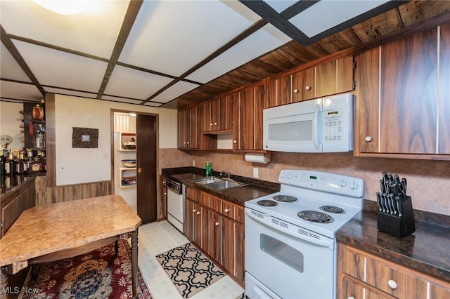 5761 Goodman Cir, North Royalton, OH 44133 - kitchen with white appliances, a sink, dark countertops, and brown cabinetry