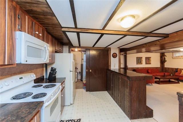 5761 Goodman Cir, North Royalton, OH 44133 - kitchen featuring white appliances, dark countertops, open floor plan, and a peninsula