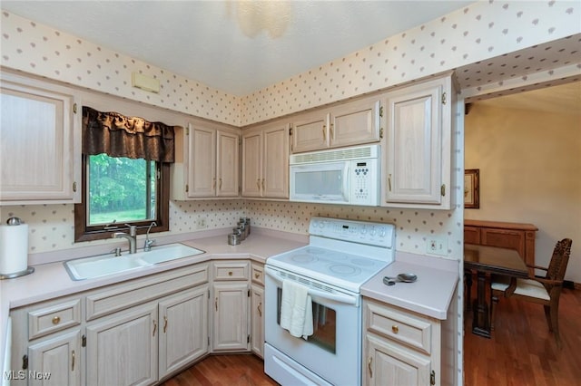5761 Goodman Cir, North Royalton, OH 44133 - kitchen with white appliances, a sink, wood finished floors, and light countertops