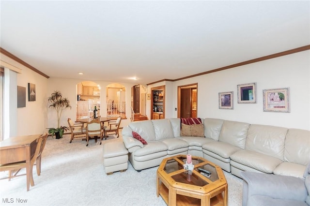 5761 Goodman Cir, North Royalton, OH 44133 - living area featuring arched walkways, light colored carpet, and ornamental molding
