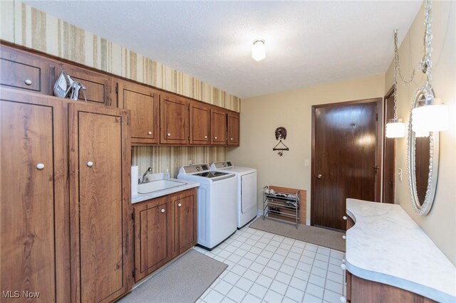 5761 Goodman Cir, North Royalton, OH 44133 - laundry room with washing machine and clothes dryer and cabinet space