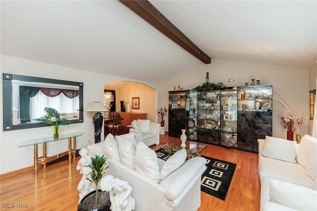 5761 Goodman Cir, North Royalton, OH 44133 - living room with arched walkways and wood finished floors