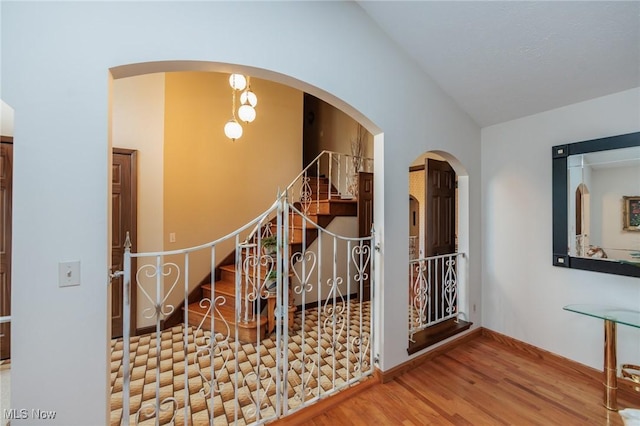 5761 Goodman Cir, North Royalton, OH 44133 - corridor featuring vaulted ceiling, wood finished floors, and stairway