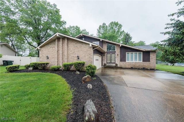 5761 Goodman Cir, North Royalton, OH 44133 - mid-century modern home featuring brick siding, concrete driveway, and a garage
