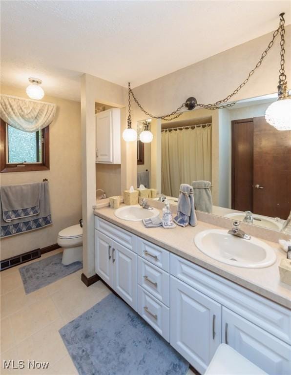 5761 Goodman Cir, North Royalton, OH 44133 - bathroom with double vanity and toilet