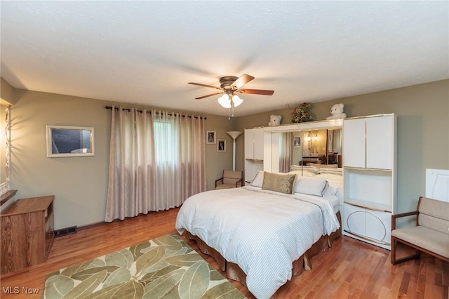 5761 Goodman Cir, North Royalton, OH 44133 - bedroom with light wood-style floors, ceiling fan, and baseboards