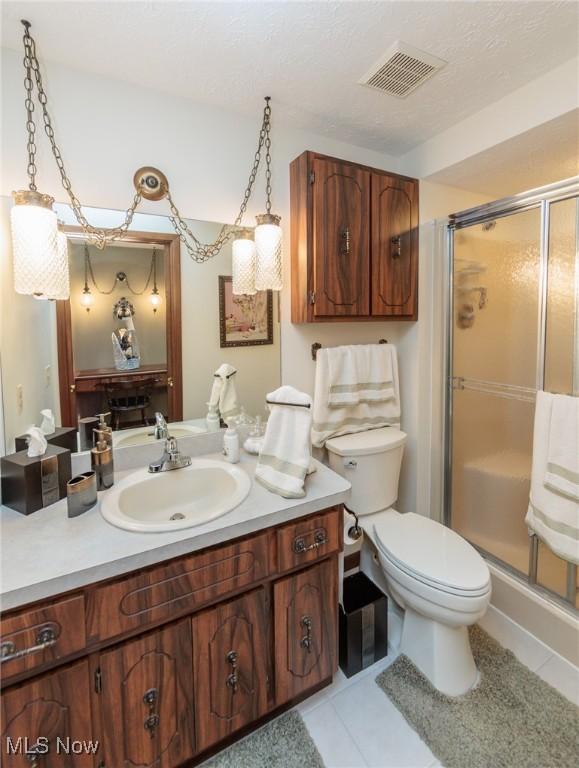5761 Goodman Cir, North Royalton, OH 44133 - bathroom with vanity, a stall shower, toilet, and tile patterned floors