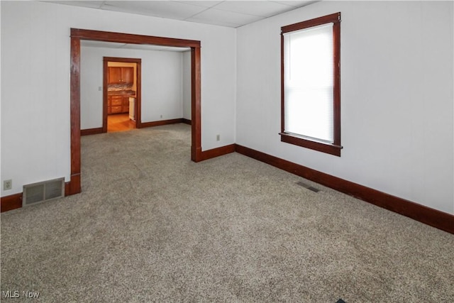 1515 E 3rd St, Port Clinton, OH 43452 - empty room with carpet floors, baseboards, and a paneled ceiling