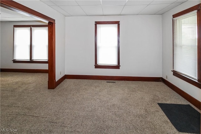1515 E 3rd St, Port Clinton, OH 43452 - spare room with a paneled ceiling, carpet flooring, plenty of natural light, and baseboards
