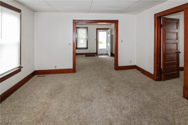 1515 E 3rd St, Port Clinton, OH 43452 - empty room with baseboards, carpet flooring, and a paneled ceiling