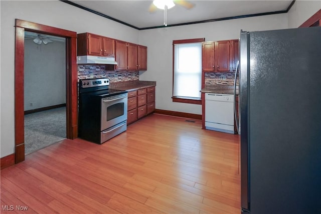 1515 E 3rd St, Port Clinton, OH 43452 - kitchen featuring freestanding refrigerator, electric range, a ceiling fan, under cabinet range hood, and ornamental molding