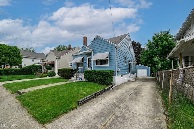 1923 15th St SW, Akron, OH 44314 - bungalow with a detached garage, driveway, and an outbuilding