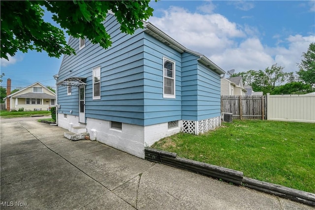 1923 15th St SW, Akron, OH 44314 - view of property exterior with cooling unit and a patio