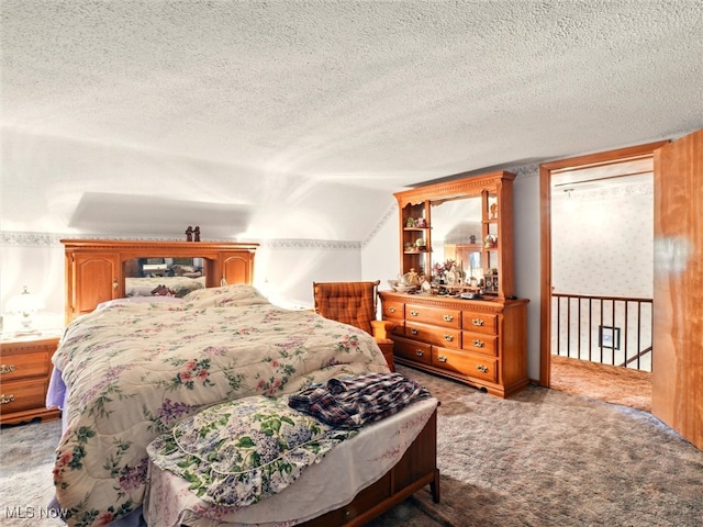 3912 Austinburg Rd, Ashtabula, OH 44004 - bedroom featuring carpet flooring, vaulted ceiling, and a textured ceiling
