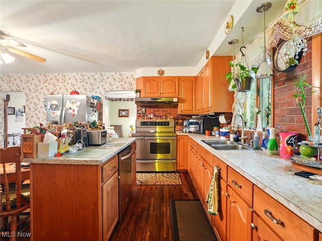 3912 Austinburg Rd, Ashtabula, OH 44004 - kitchen featuring stainless steel appliances, a sink, under cabinet range hood, light countertops, and dark wood-style floors
