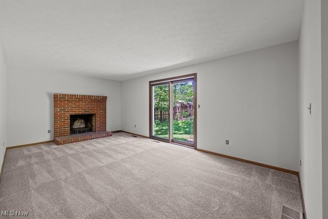 7124 Hollyhock Ln, Solon, OH 44139 - unfurnished living room featuring carpet floors, baseboards, and a brick fireplace