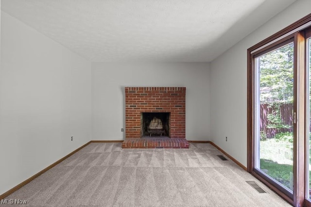 7124 Hollyhock Ln, Solon, OH 44139 - unfurnished living room featuring plenty of natural light, light carpet, and baseboards