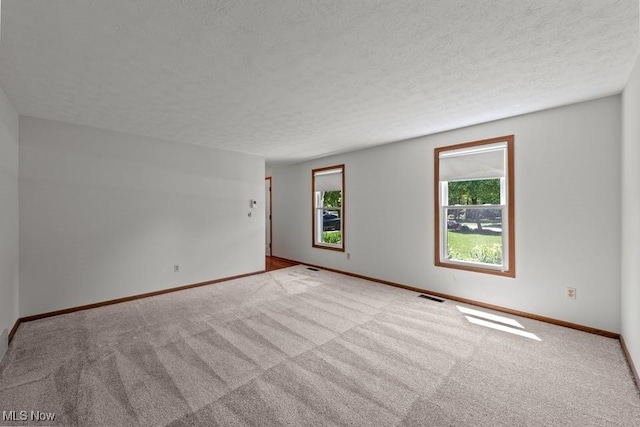 7124 Hollyhock Ln, Solon, OH 44139 - unfurnished room featuring carpet, baseboards, and a textured ceiling