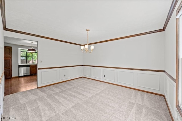 7124 Hollyhock Ln, Solon, OH 44139 - unfurnished room featuring light carpet, ornamental molding, a chandelier, a wainscoted wall, and a decorative wall