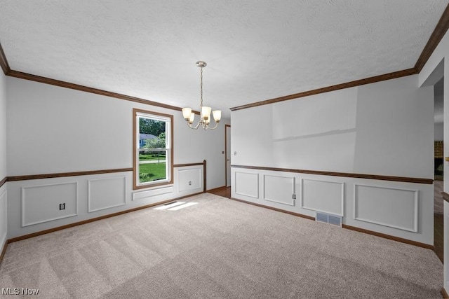 7124 Hollyhock Ln, Solon, OH 44139 - carpeted empty room featuring a chandelier, a decorative wall, crown molding, and wainscoting