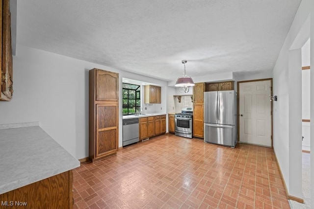 7124 Hollyhock Ln, Solon, OH 44139 - kitchen featuring stainless steel appliances, brick patterned flooring, baseboards, brown cabinets, and light countertops