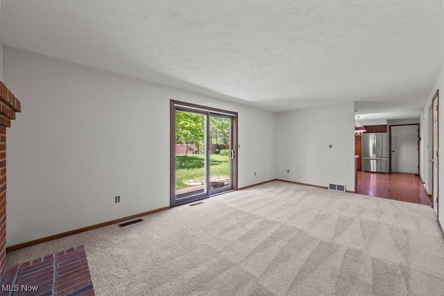 7124 Hollyhock Ln, Solon, OH 44139 - unfurnished living room with light carpet, baseboards, and a textured ceiling