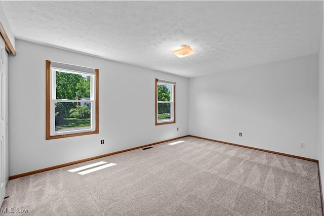 7124 Hollyhock Ln, Solon, OH 44139 - carpeted empty room featuring baseboards and a textured ceiling