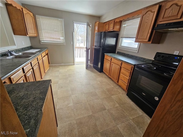 2889 State Route 46 S, Jefferson, OH 44047 - kitchen featuring under cabinet range hood, black appliances, a sink, and healthy amount of natural light