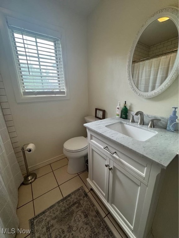 1505 N 14th St, Cambridge, OH 43725 - bathroom with vanity, toilet, and tile patterned flooring