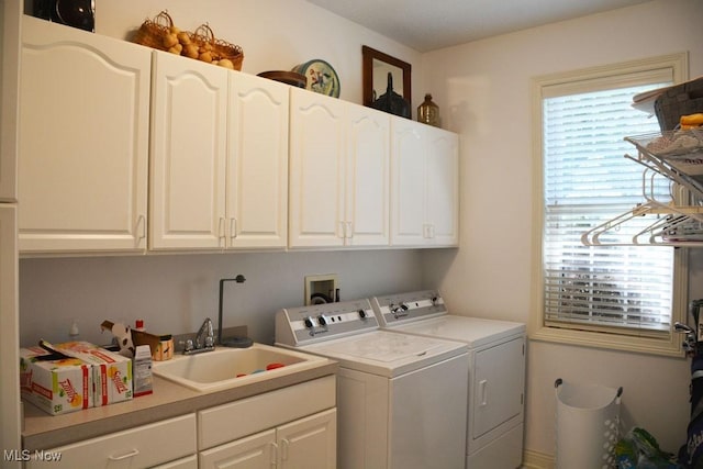 7711 Marewood Pl, Painesville, OH 44077 - laundry room with washing machine and clothes dryer and cabinet space