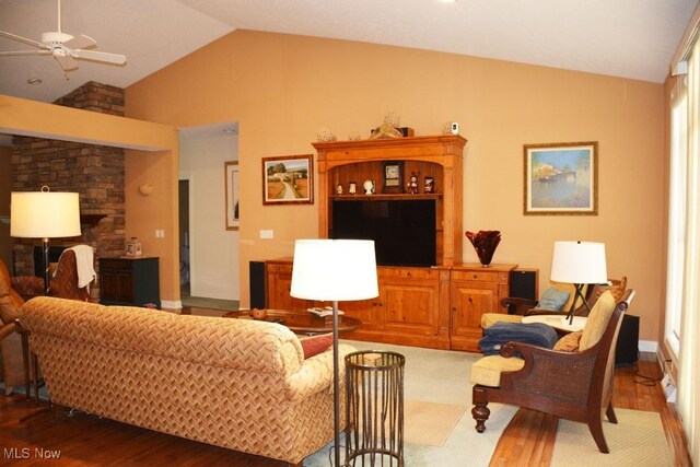 7711 Marewood Pl, Painesville, OH 44077 - living area with a ceiling fan, wood finished floors, high vaulted ceiling, and baseboards