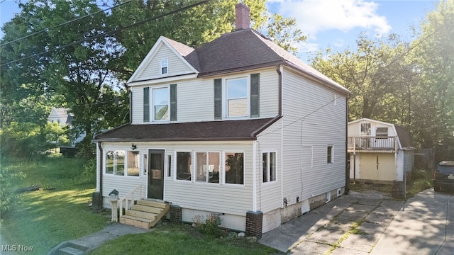 361 Para Ave, Akron, OH 44305 - traditional home featuring a shingled roof, entry steps, a front yard, and a chimney