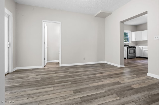 361 Para Ave, Akron, OH 44305 - empty room featuring wood finished floors, baseboards, and a textured ceiling