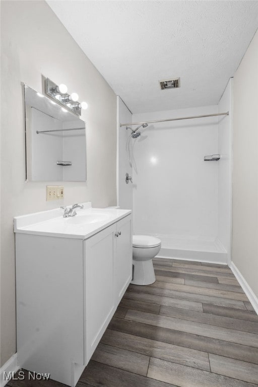 361 Para Ave, Akron, OH 44305 - bathroom with a shower, vanity, toilet, and wood finished floors