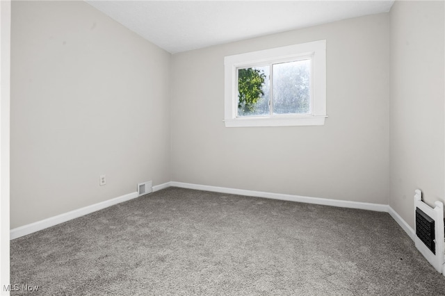 361 Para Ave, Akron, OH 44305 - empty room featuring carpet, baseboards, and heating unit